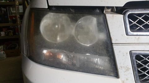 Cloudy, oxidized headlight lens before restoration