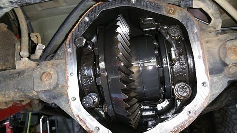 Open Jeep rear differential showing a freshly installed air locker and ring gear